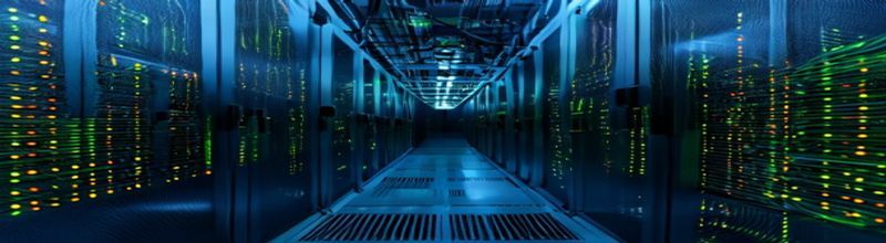 Panoramic close-up of a server-rack data centre aisle in deep blue light, neat columns of network switches with green and amber LED activity lights flickering down both walls, looped fibre optic cables running overhead, a closed steel cage door at the far end, no people no faces no hands